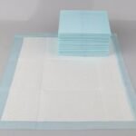 Finished disposable absorbent underpads produced by the machine