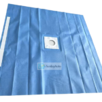 Finished adhesive fenestrated surgical drape with positioned aperture